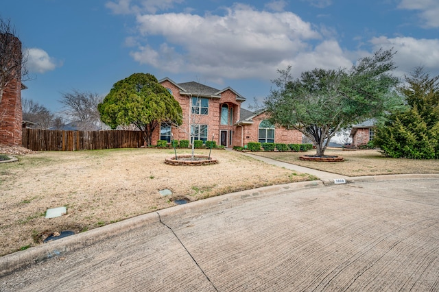 view of property with a front lawn