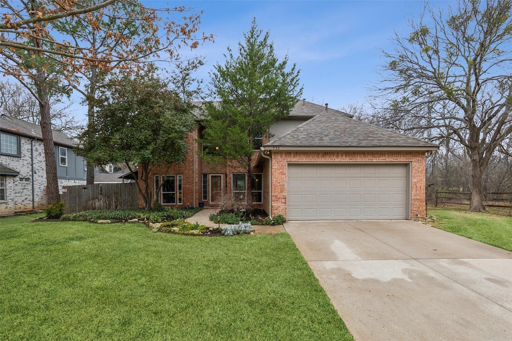 view of front of house featuring a garage and a front yard