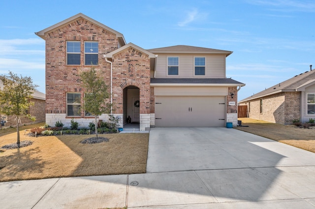 front of property featuring a garage and a front yard