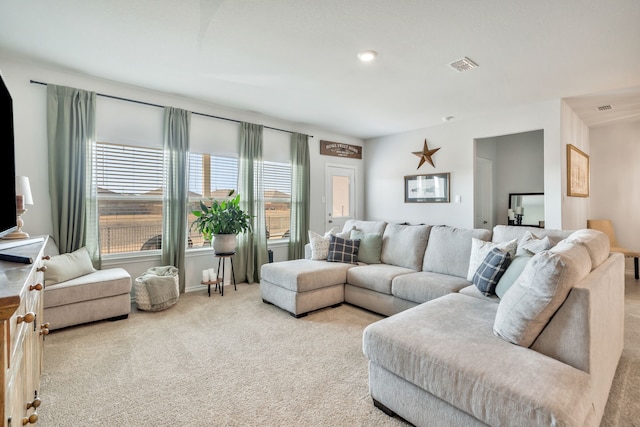 living room featuring light carpet