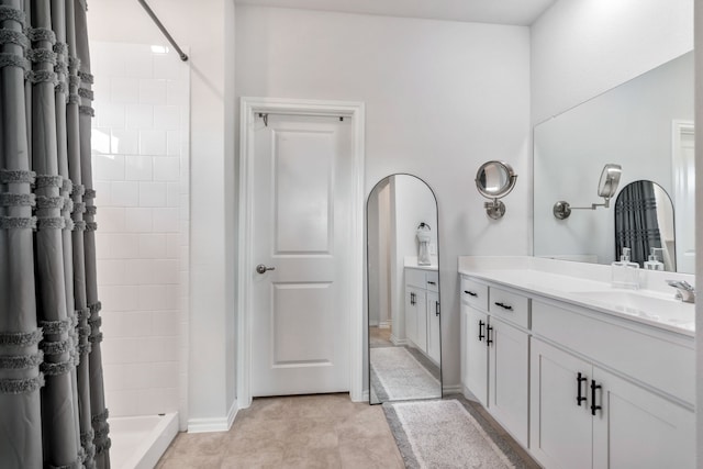 bathroom featuring vanity and walk in shower