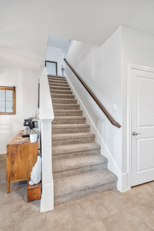 stairs featuring tile patterned flooring