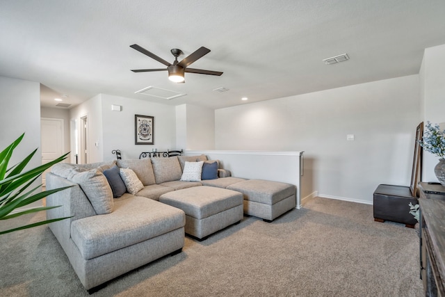 carpeted living room with ceiling fan