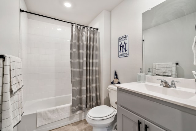 full bathroom featuring vanity, toilet, and shower / tub combo