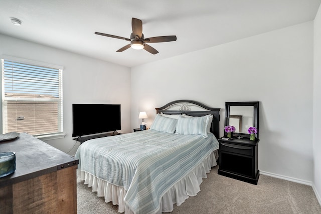 bedroom featuring light carpet and ceiling fan