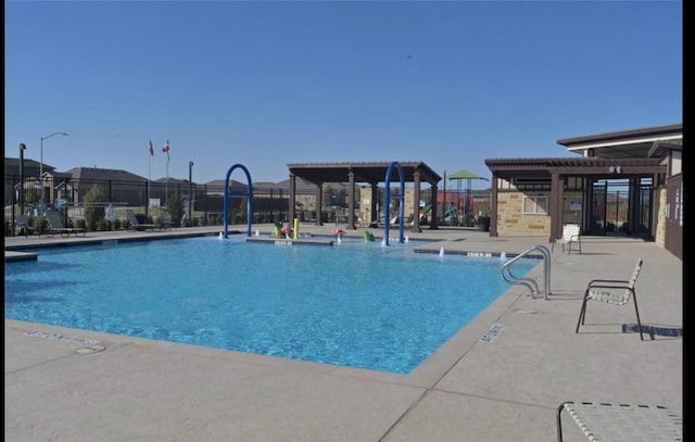 view of swimming pool with a pergola and a patio area