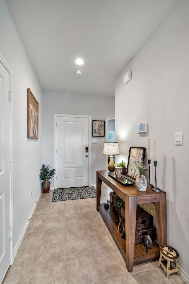 entryway with light tile patterned floors