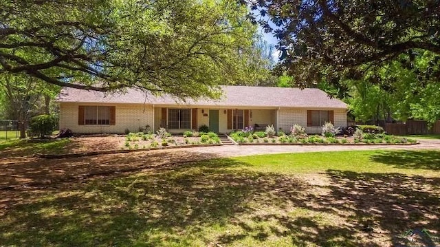 ranch-style house with a front yard