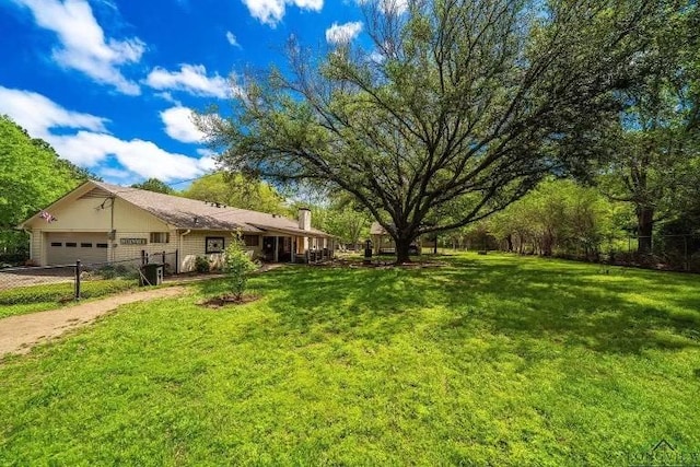 view of yard featuring a garage