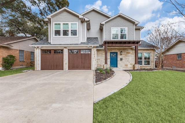 view of front of home with a garage and a front yard