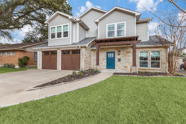 view of front of property featuring a garage and a front yard