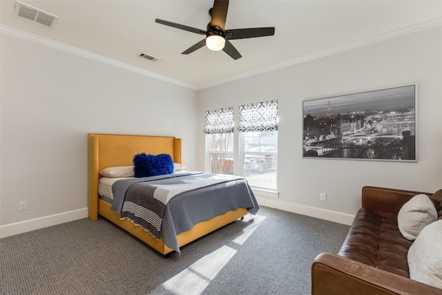 carpeted bedroom featuring crown molding and ceiling fan