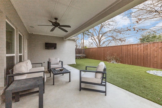 view of patio with an outdoor hangout area and ceiling fan