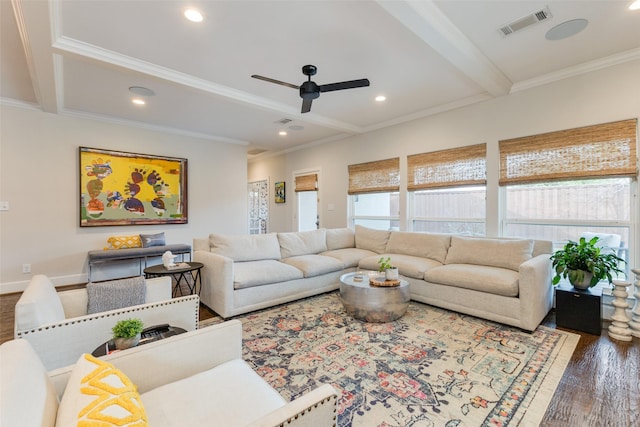 living room featuring beamed ceiling, ceiling fan, dark hardwood / wood-style flooring, and crown molding