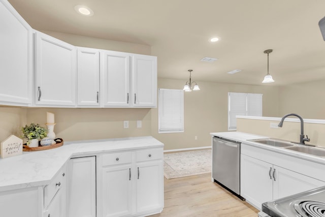 kitchen featuring decorative light fixtures, dishwasher, sink, and white cabinets