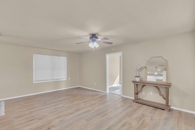 spare room with ceiling fan and light hardwood / wood-style flooring