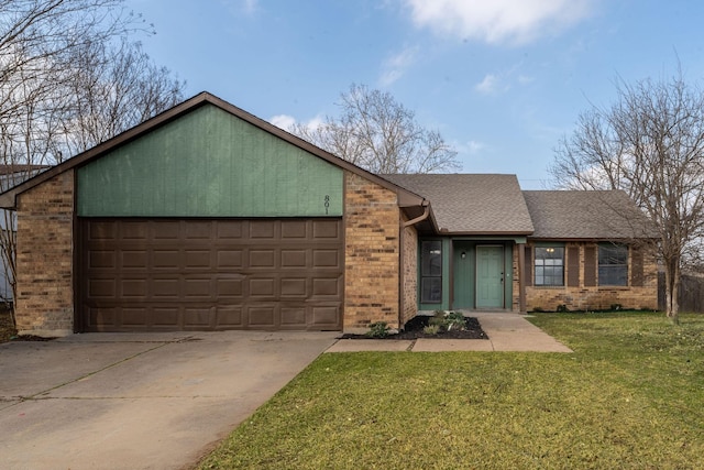 ranch-style home featuring a garage and a front yard