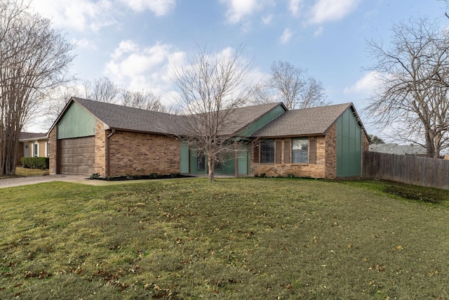 single story home with a garage and a front yard