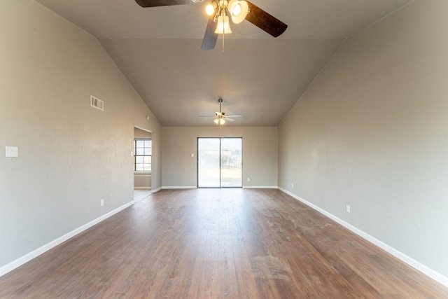 empty room with vaulted ceiling, ceiling fan, and hardwood / wood-style floors