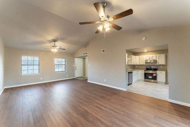 unfurnished living room featuring hardwood / wood-style flooring, lofted ceiling, and ceiling fan