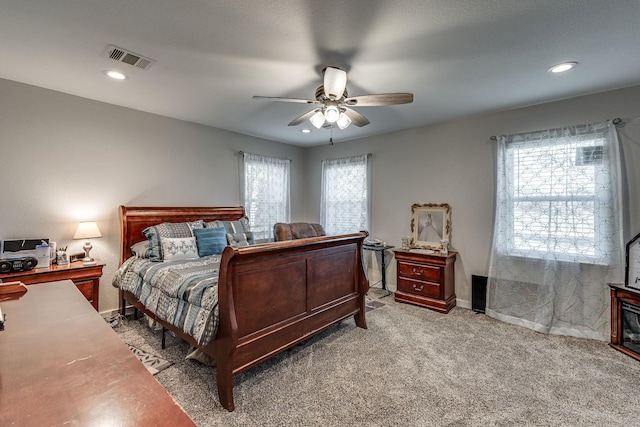 carpeted bedroom featuring ceiling fan