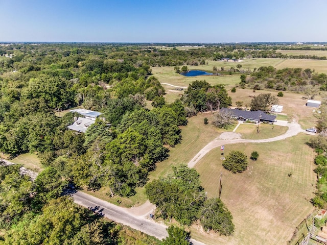 birds eye view of property with a rural view