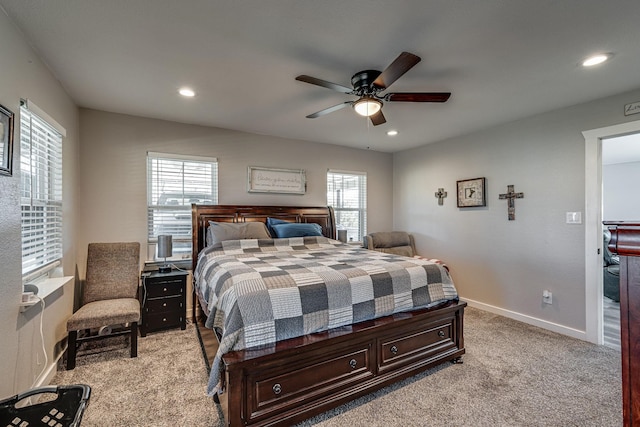 bedroom with ceiling fan and light carpet