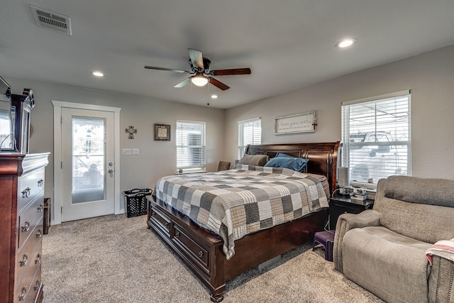 bedroom with ceiling fan, access to exterior, and light carpet