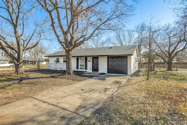 ranch-style home with a garage