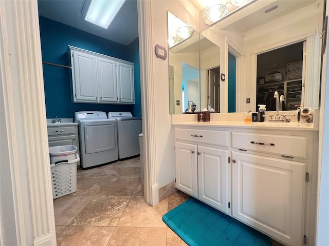 bathroom with vanity and washer and dryer