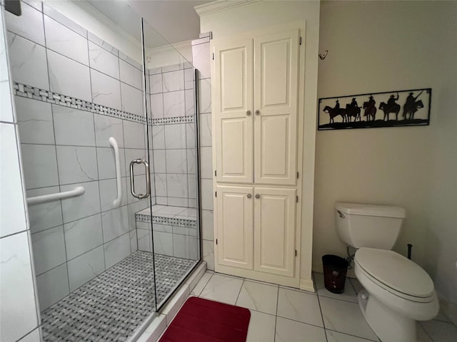 bathroom with a shower with door and toilet