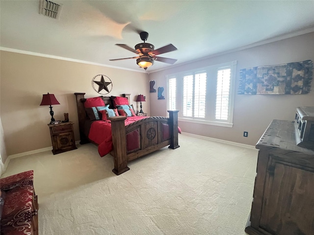 bedroom featuring crown molding, light colored carpet, and ceiling fan