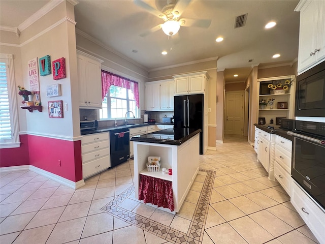 kitchen featuring black appliances, a center island, white cabinets, and light tile patterned flooring