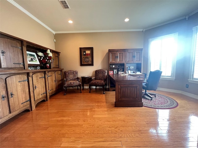 office area with ornamental molding and light hardwood / wood-style floors