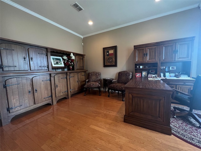 office featuring ornamental molding and light hardwood / wood-style floors