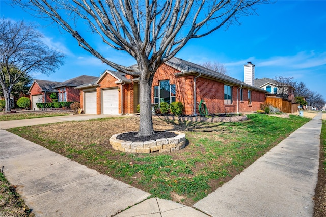 ranch-style home with a garage and a front yard