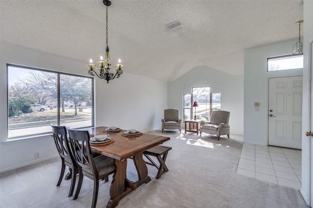 carpeted dining area with vaulted ceiling, a notable chandelier, and a textured ceiling