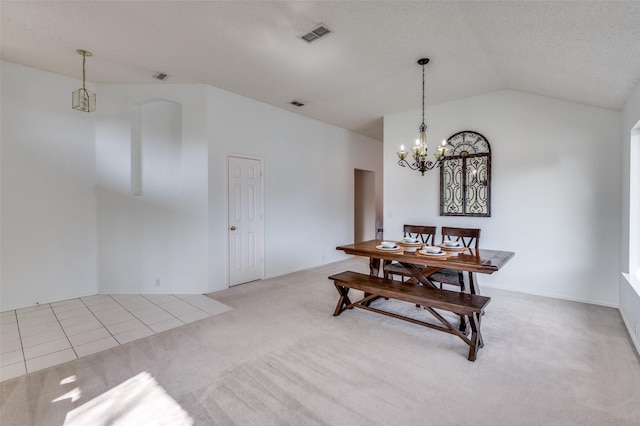 carpeted dining area featuring a textured ceiling, vaulted ceiling, and a chandelier