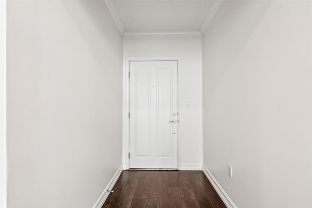 entryway with crown molding and dark wood-type flooring