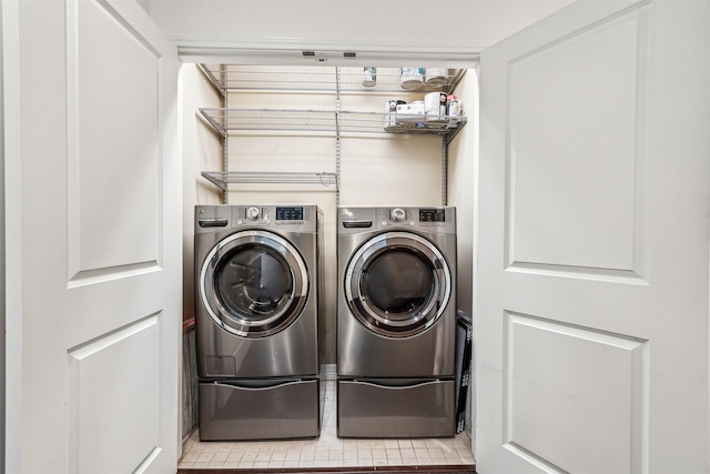 laundry area featuring washing machine and clothes dryer