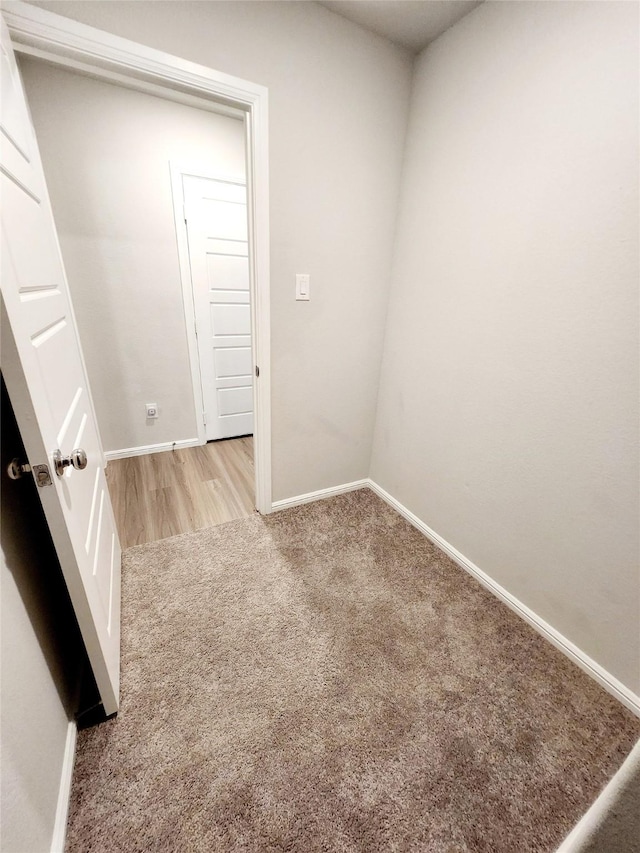 spare room with light colored carpet