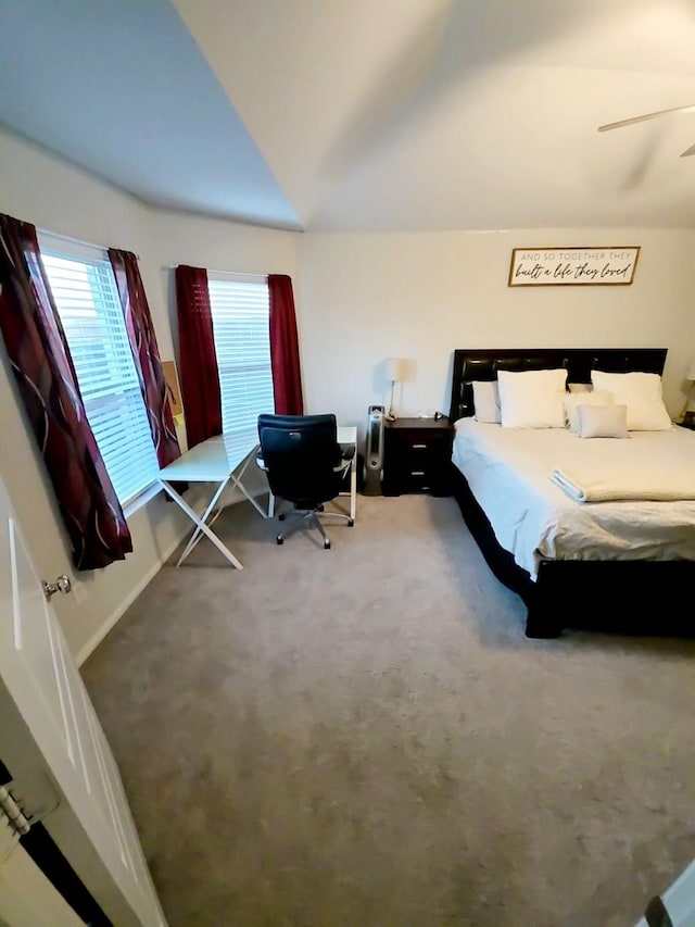 unfurnished bedroom featuring vaulted ceiling and carpet