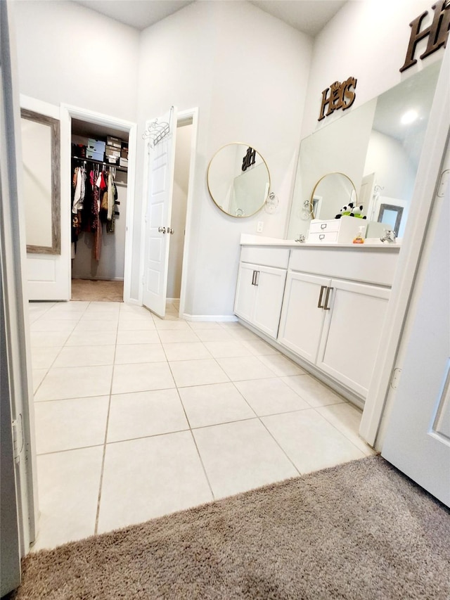 bathroom featuring tile patterned flooring and vanity