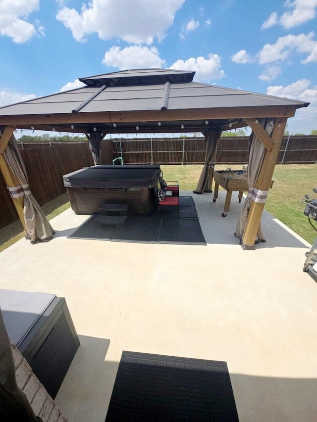 view of car parking with a gazebo and a lawn