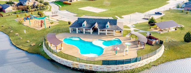 birds eye view of property with a water view