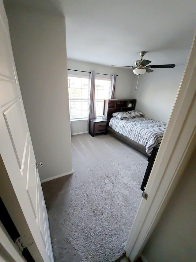 bedroom featuring ceiling fan and carpet flooring