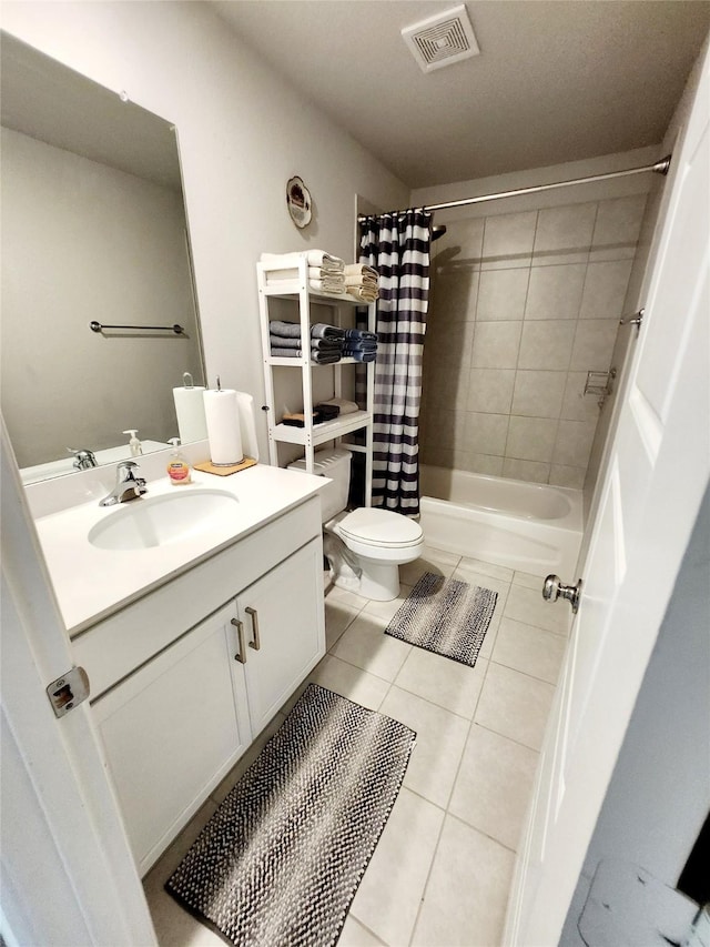 full bathroom featuring tile patterned floors, toilet, shower / tub combo, and vanity