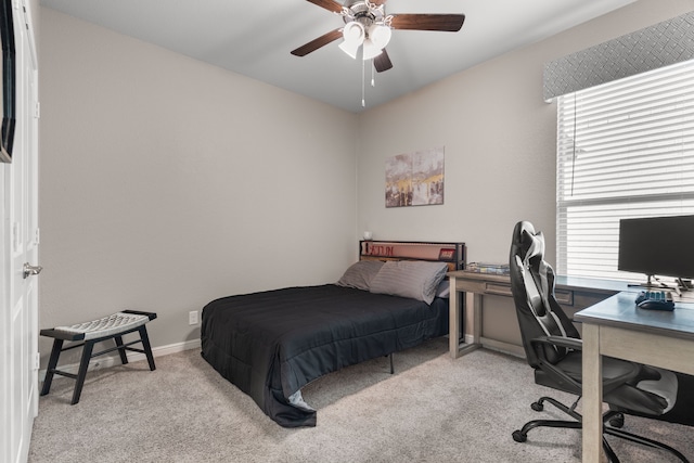 bedroom with light carpet and ceiling fan