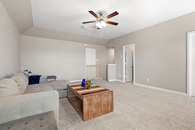 living room with ceiling fan and light colored carpet