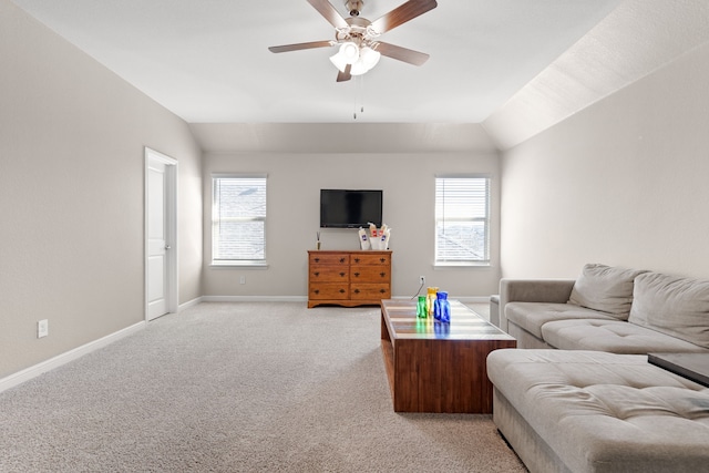 carpeted living room featuring vaulted ceiling and ceiling fan